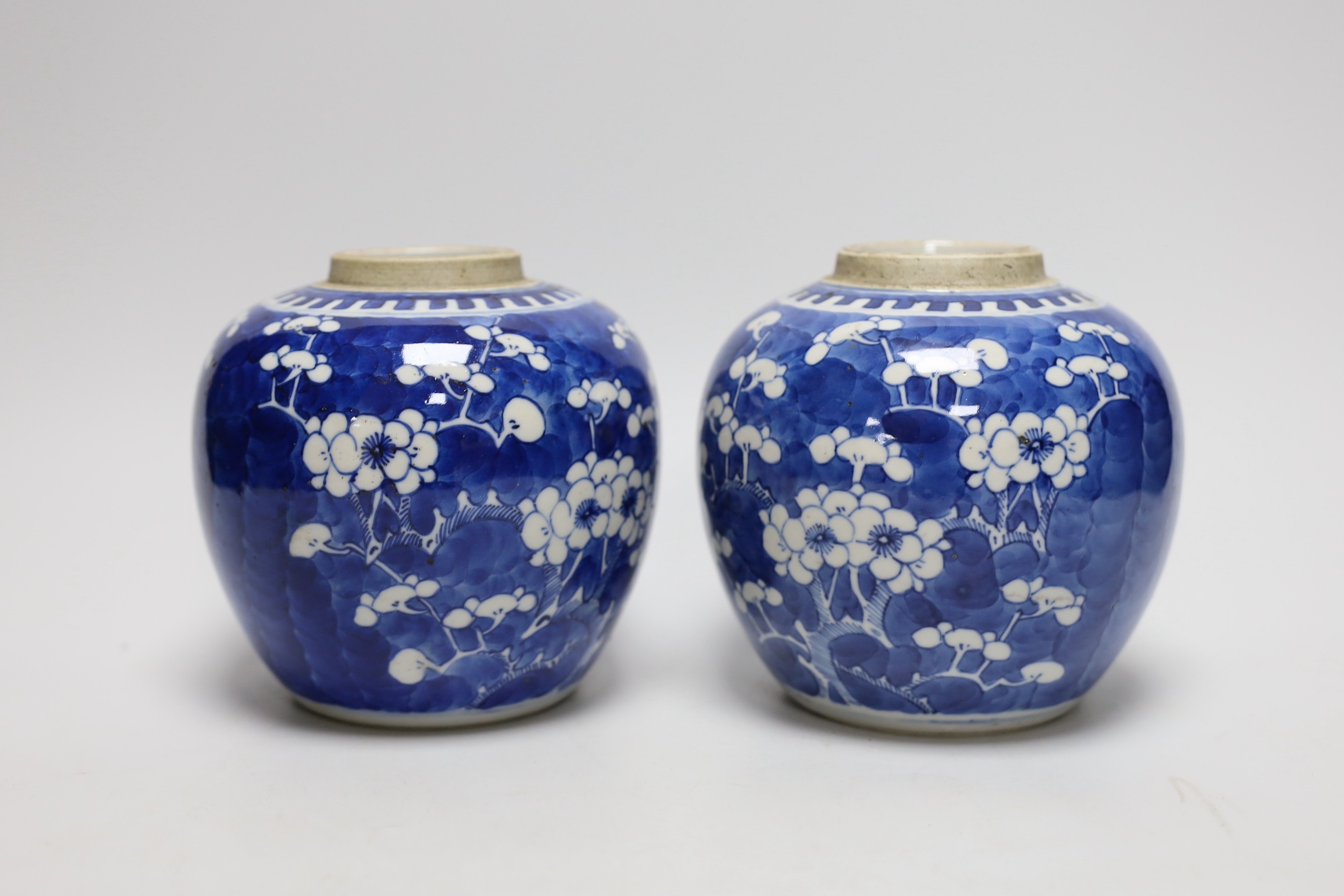 A pair of 19th centiury Chinese blue and white prunus jars, 13.5cms high